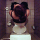 A hidden camera in a bathroom ceiling records a girl taking a shit while reading a comic book. When she stands up to wipe, some product is visible in the toilet. Video is a little dark and grainy but still presented in 720P HD. About 2.5 minutes.